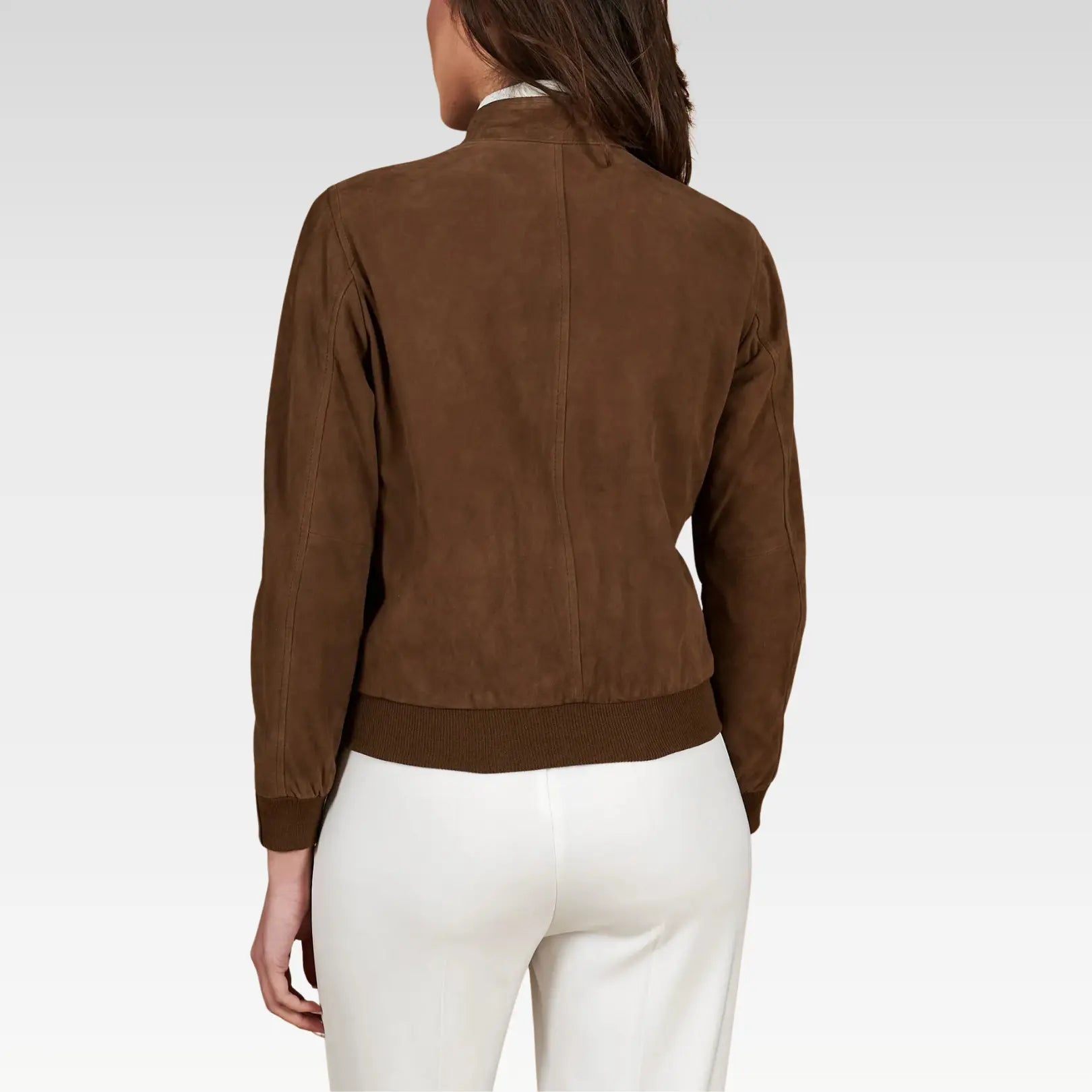 Brown suede jacket worn by a person on a white background