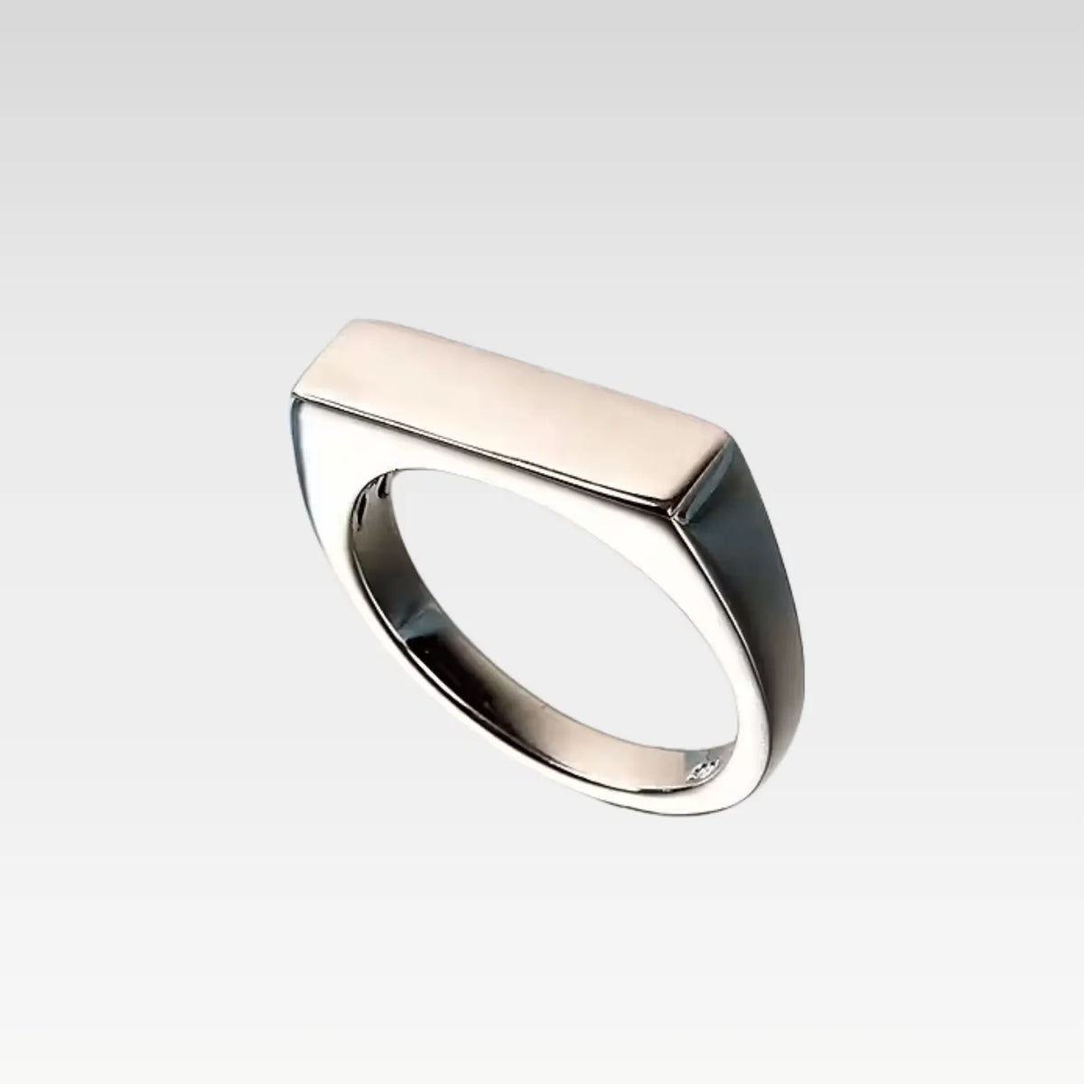 Structured sterling silver flat top ring with a thick band and rhodium-plated shine

