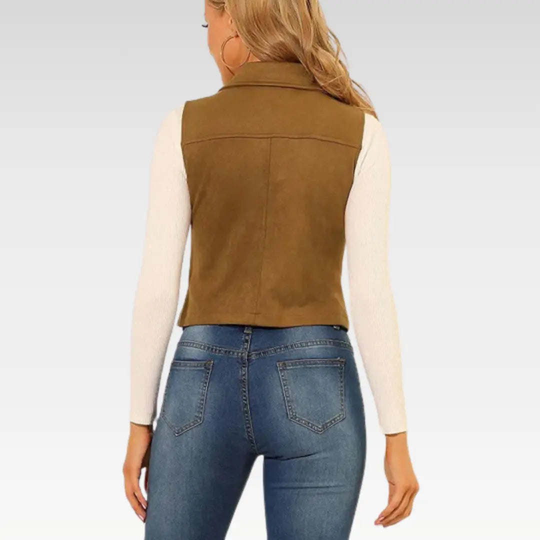 Back view of woman wearing camel brown suede leather vest with jeans