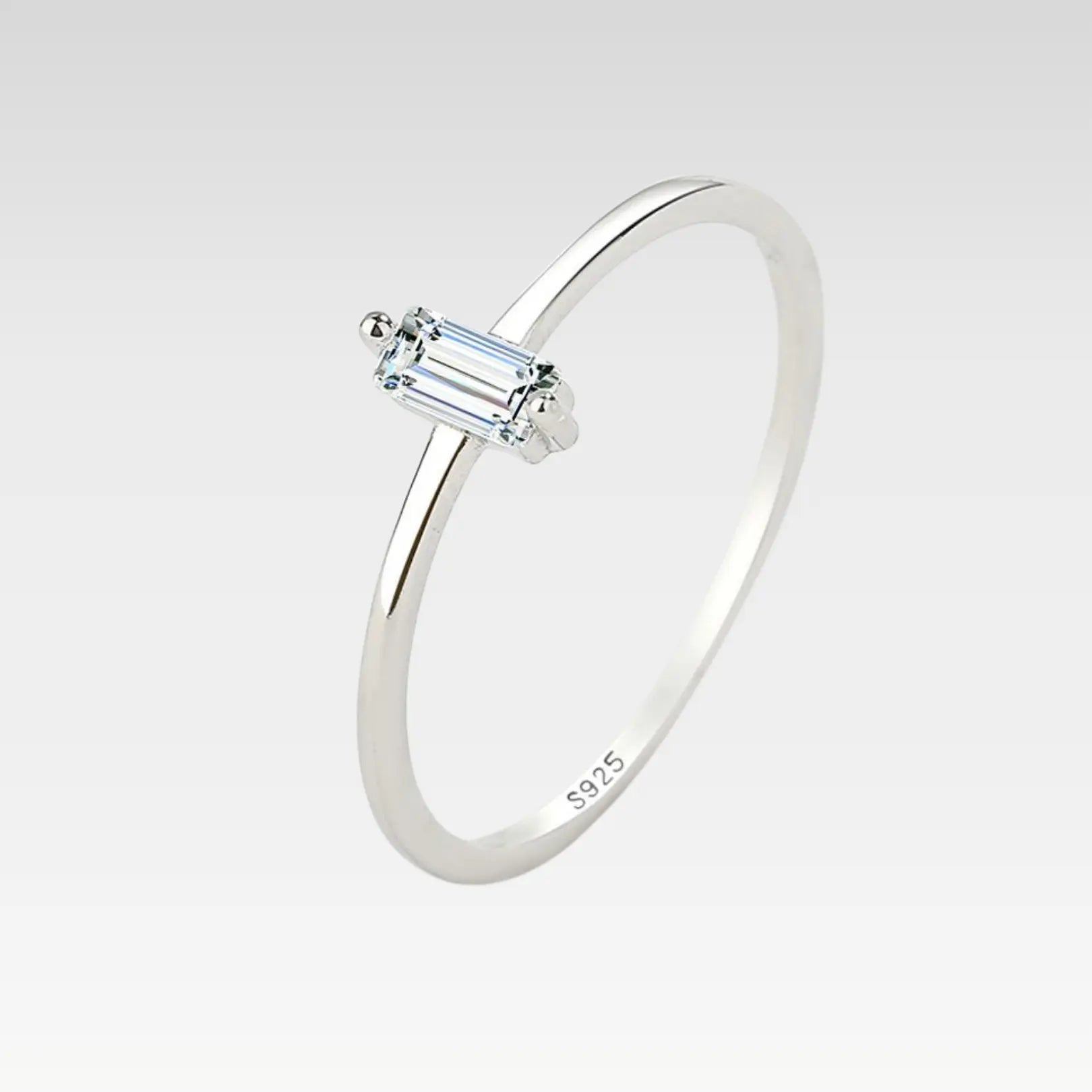 Modern zircon ring showcasing a baguette-cut white zircon on a sleek silver band.