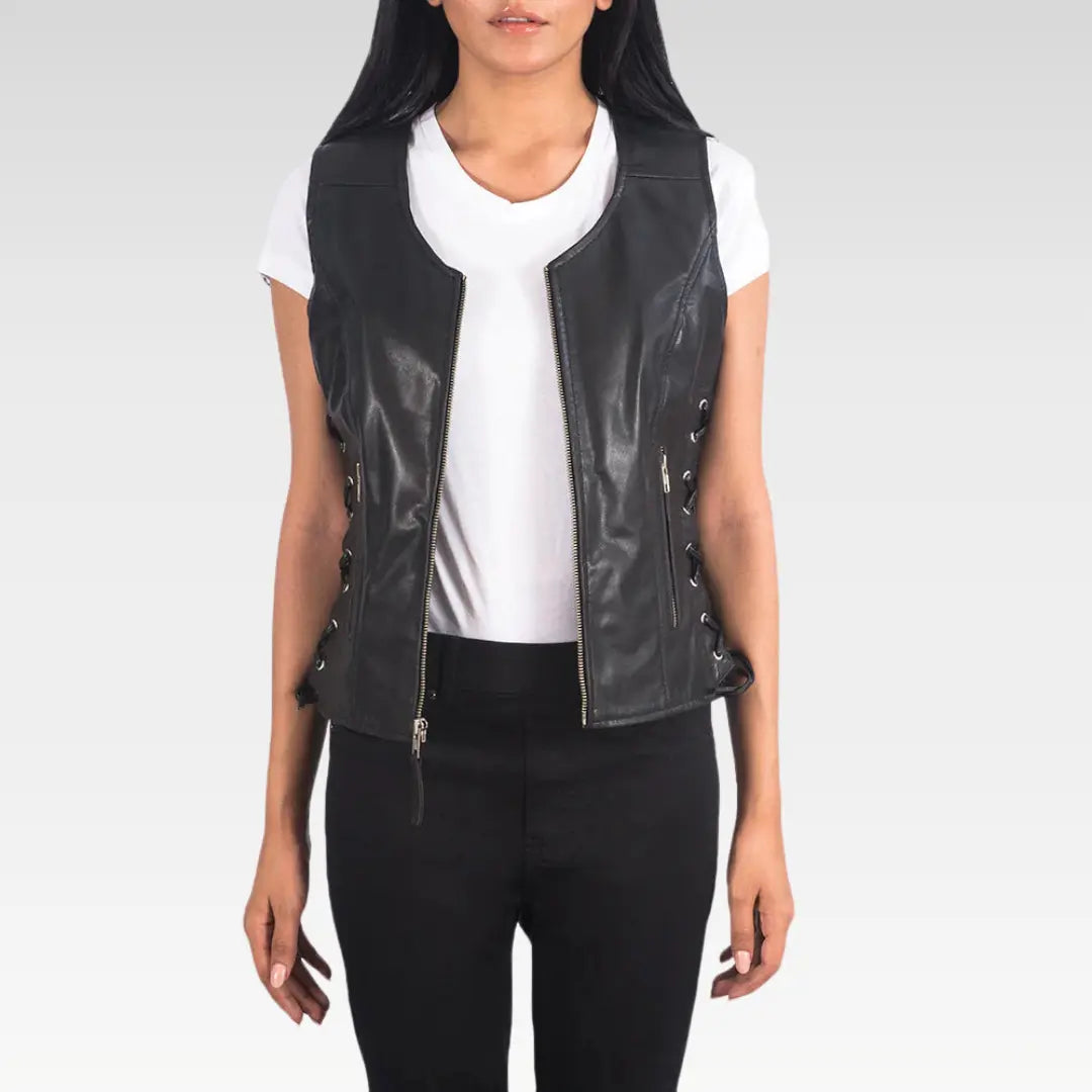 Black goatskin biker vest styled over a white T-shirt with visible zipper and pockets