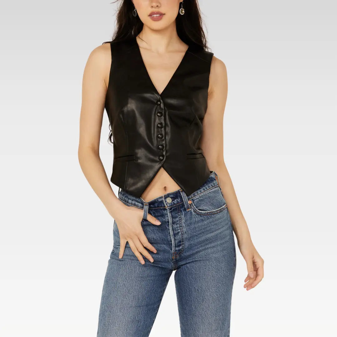 Model wearing the Revel women's black lambskin leather vest, buttoned down over a mesh top and denim.