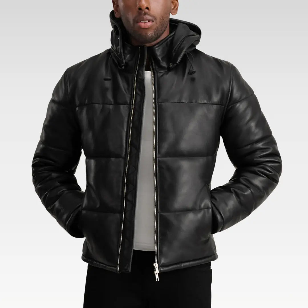 Model wearing the Gordon Black Hooded Leather Puffer Jacket with hood up, showcasing modern street-style appeal.