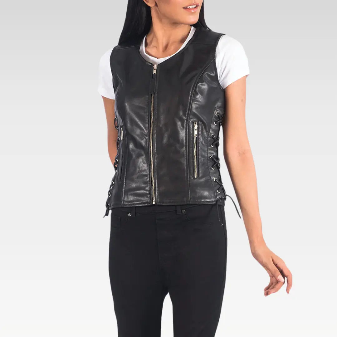Model showcasing black leather biker vest paired with a fitted white top and black pants