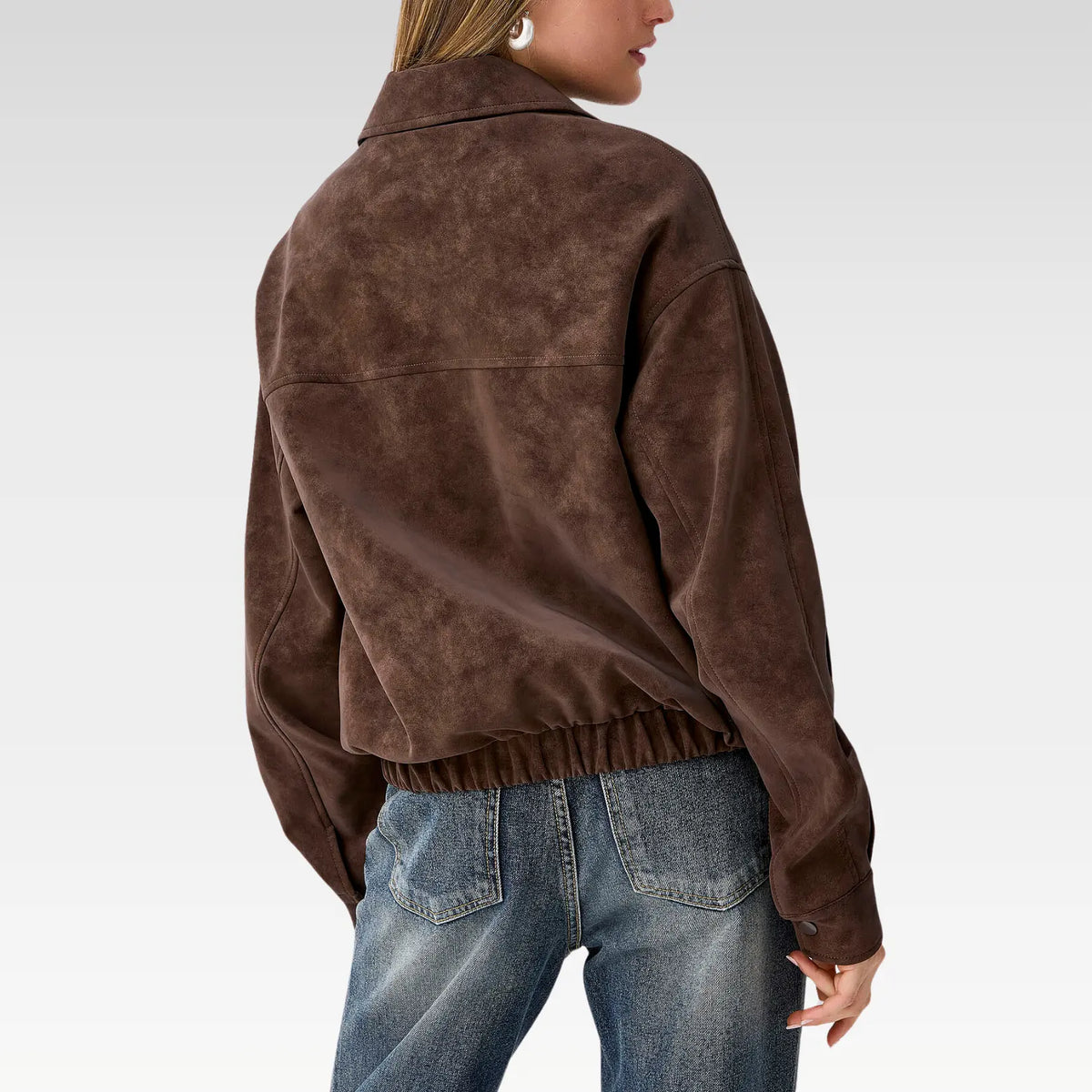 Back view of Lyra oversized suede-finish jacket showing relaxed silhouette and elastic trim detail in rich brown