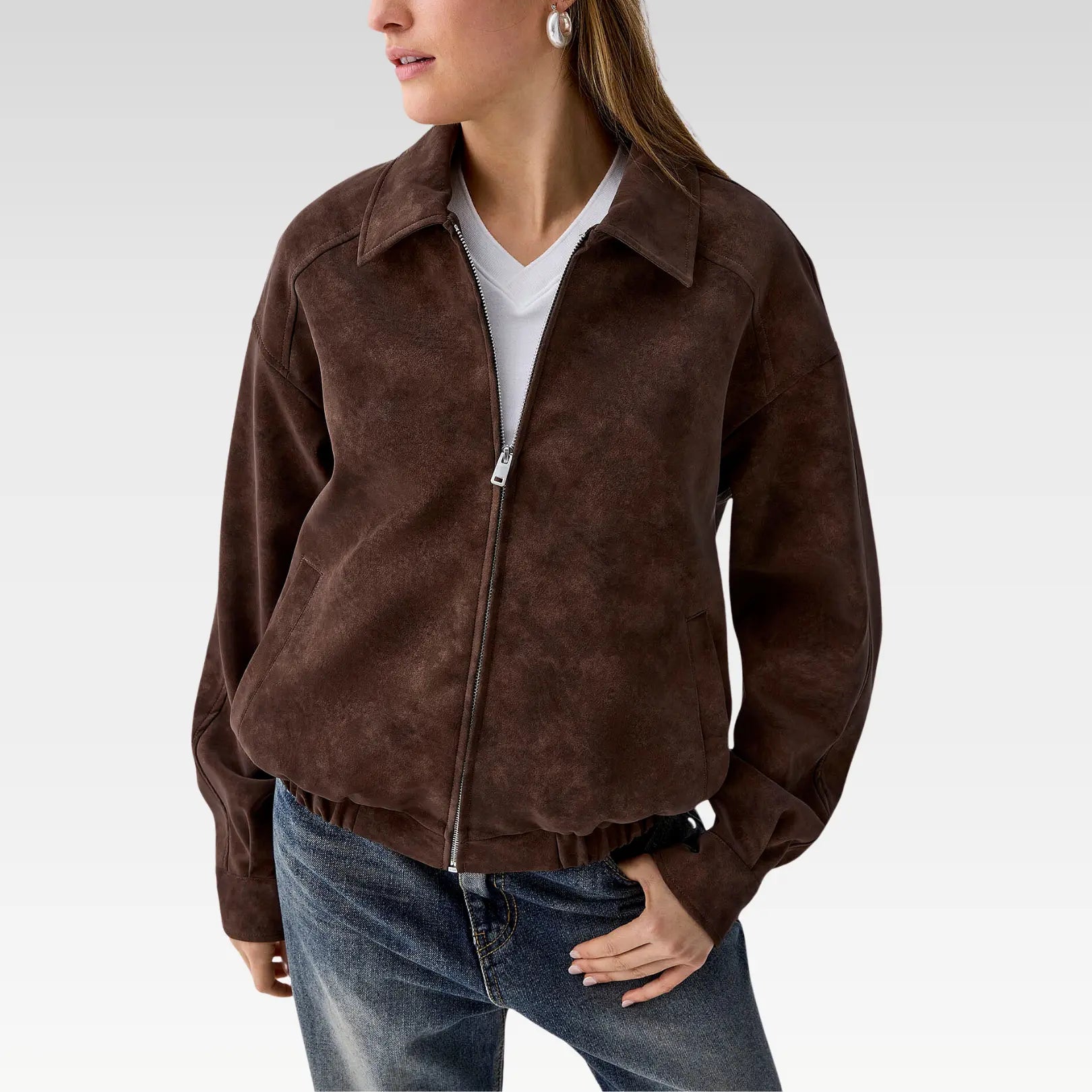 Model wearing Lyra oversized suede-finish jacket open at the front, styled with jeans and a white crop top for casual streetwear look.