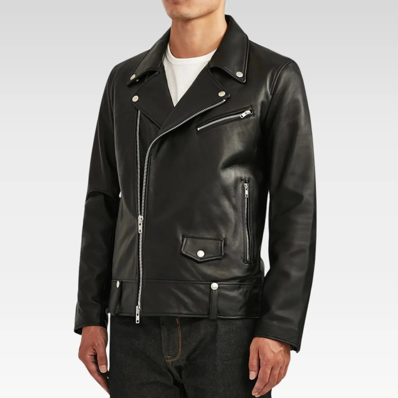 Styled look of the Men’s Classic Black Biker Leather Jacket paired with jeans, highlighting lapel collar and zip pockets.