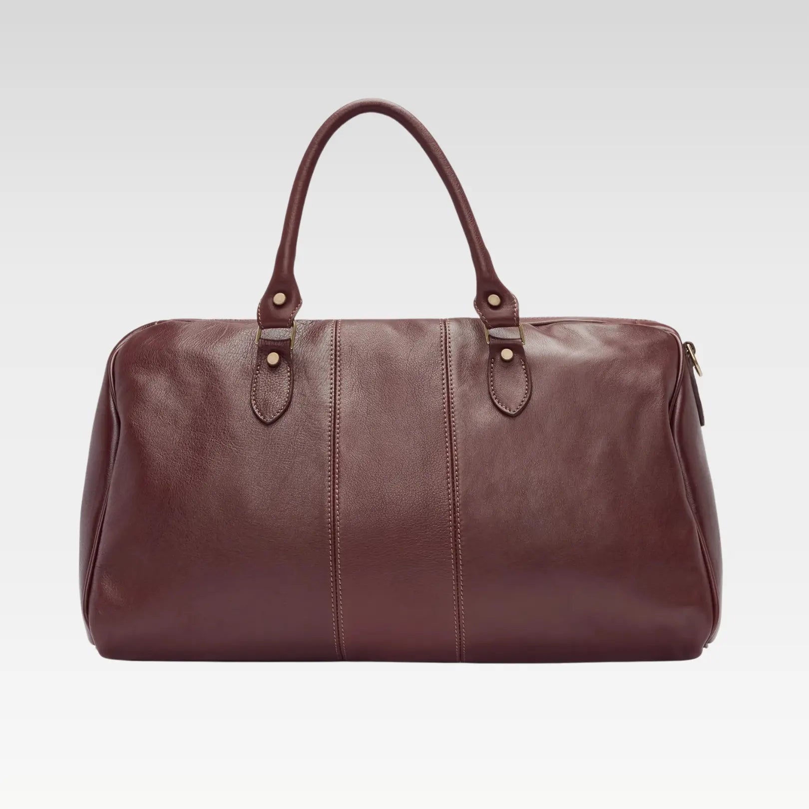 Full product view of the Saddler duffle bag, featuring its sleek silhouette, sturdy handles, and luxe full-grain leather finish.