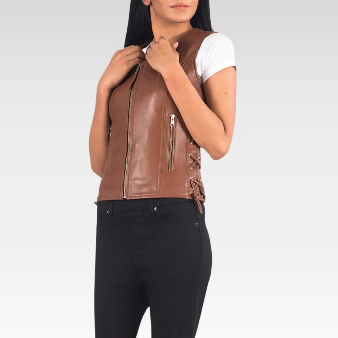 Model in brown goatskin leather biker vest with visible side laces and sleeveless cut