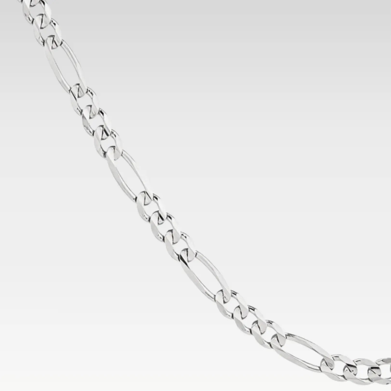 Sterling silver Figaro chain necklace displayed against a white background, emphasizing its lightweight, versatile style.