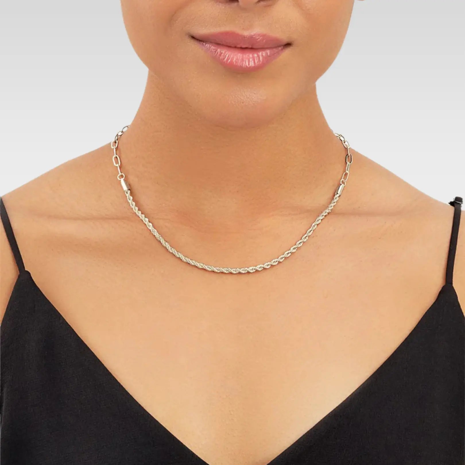 Woman modeling sterling silver rope twist chain necklace, showcasing how the adjustable length flatters the neckline for daily wear