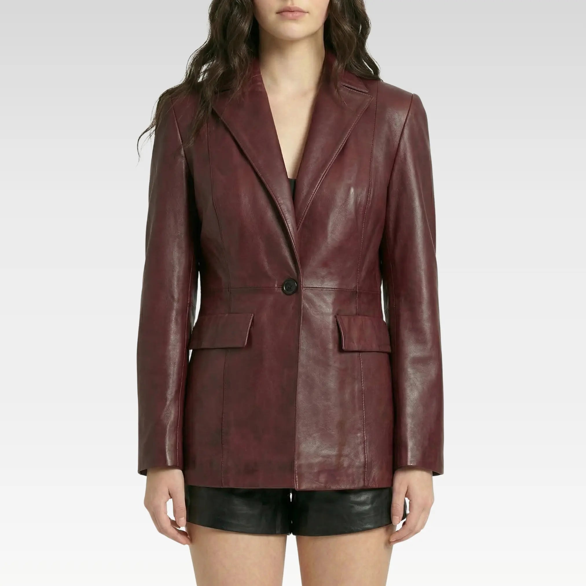Front view of women’s burgundy lambskin leather blazer with structured fit