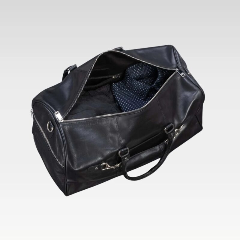 Open interior of Apex 45L leather duffel bag showing spacious main compartment with two internal zip pockets for organized packing.