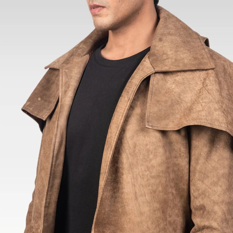 Detailed close-up of Army brown leather duster pocket with flap closure, showcasing rugged craftsmanship.