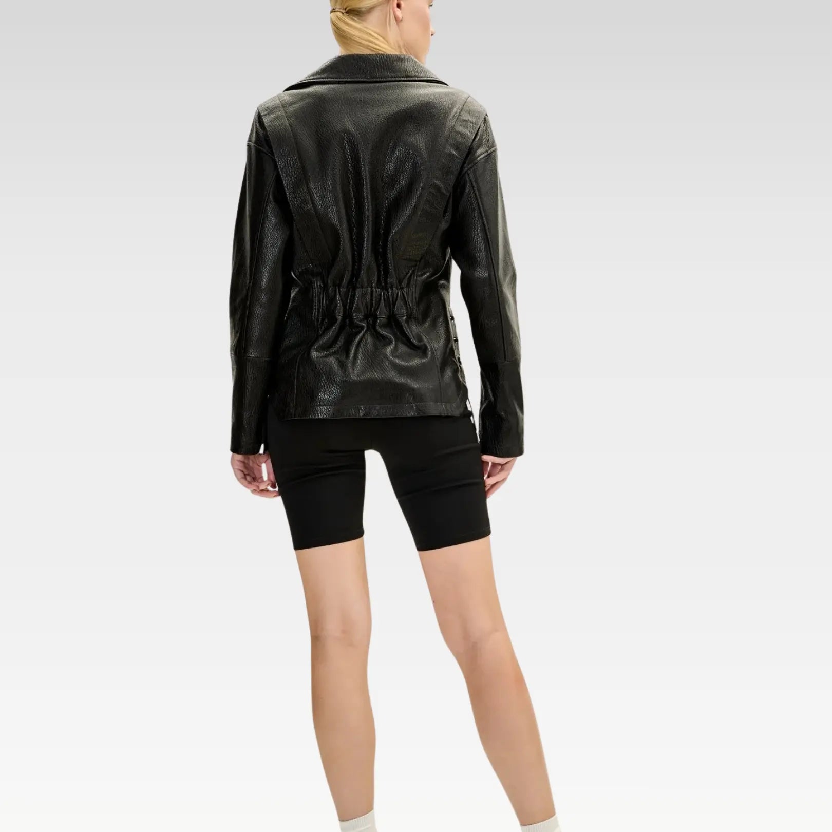 Front view of black lambskin leather biker jacket featuring adjustable leather strings at sides, silver hardware, and classic biker styling