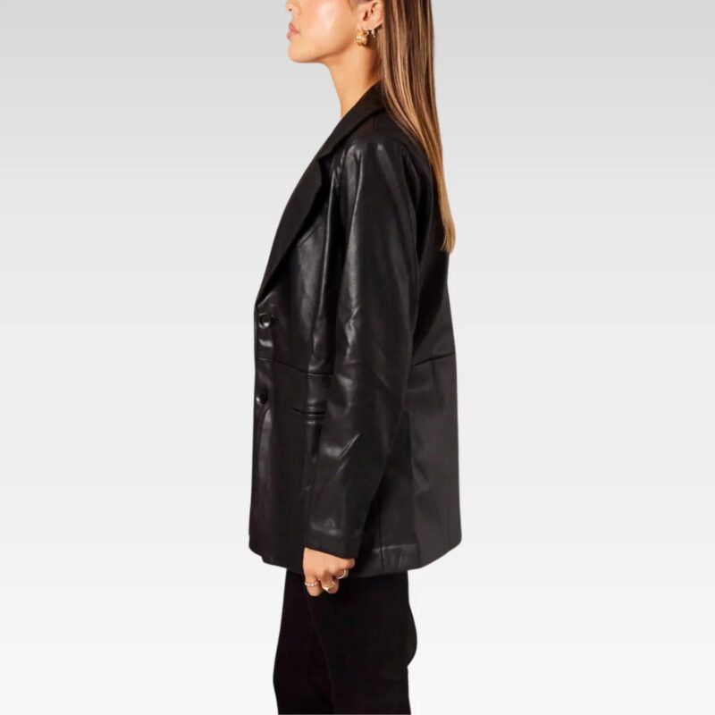 Black leather collared jacket with oversized fit, featuring a button-up front and side pockets, perfect for a modern and stylish look.