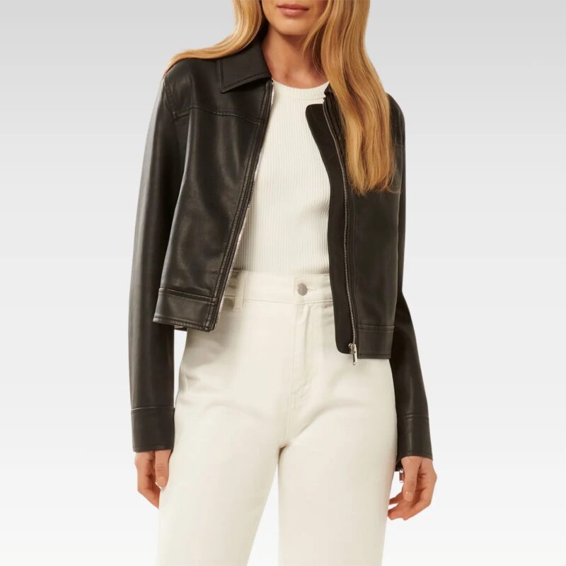 Three-quarter view of black collared leather jacket featuring structured classic collar, zip-up front closure, and cropped silhouette perfect for layering