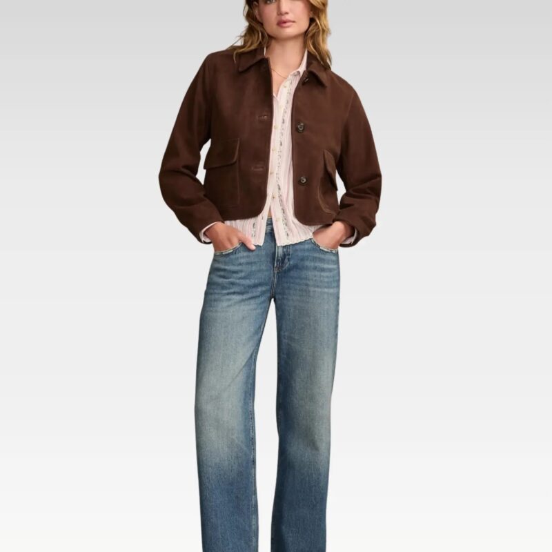 Full front view of a timeless boxy-crop suede jacket in rich brown, featuring a button-front closure and flap pockets, styled with high-rise jeans for a classic look.