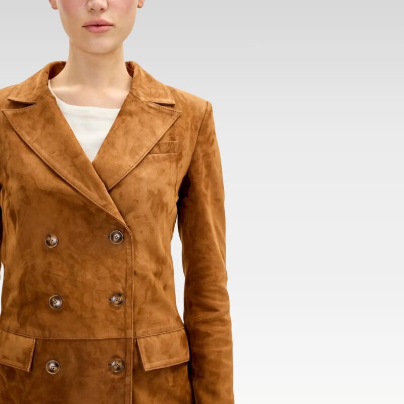 Close-up of brown lambskin suede double-breasted jacket featuring six-button front, peak lapels, and chest pocket.