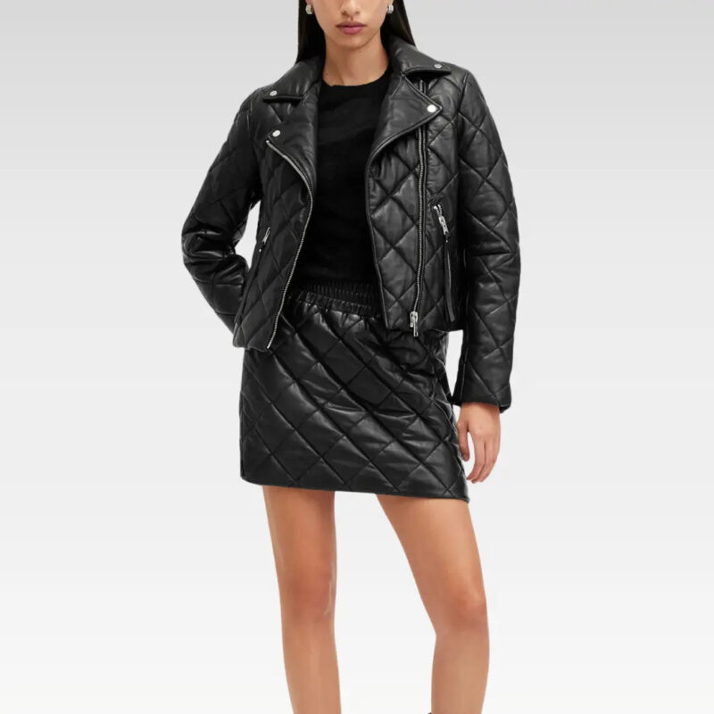 Model wearing the Dalby black quilted moto leather jacket with a mini dress, showcasing its slim fit and modern street style