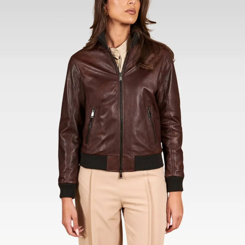 Close-up side detail of a dark brown lamb leather bomber jacket, showcasing the high neck and soft lining made of 60% polyester, 20% viscose, and 20% wool.