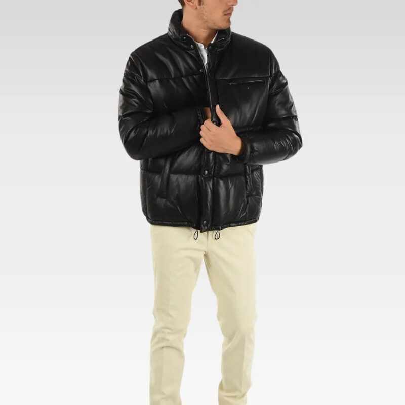 Model wearing Drexia Warm Quilted Back Leather Puffer Jacket in black, featuring premium leather finish, sleek fit, and front zipper with button closure.