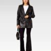 Elegant black leather jacket with a collared neckline, oversized design, and premium leather material, great for enhancing any wardrobe.