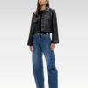 Model wearing cropped leather-look button jacket with flap pockets and relaxed drop shoulders, front view