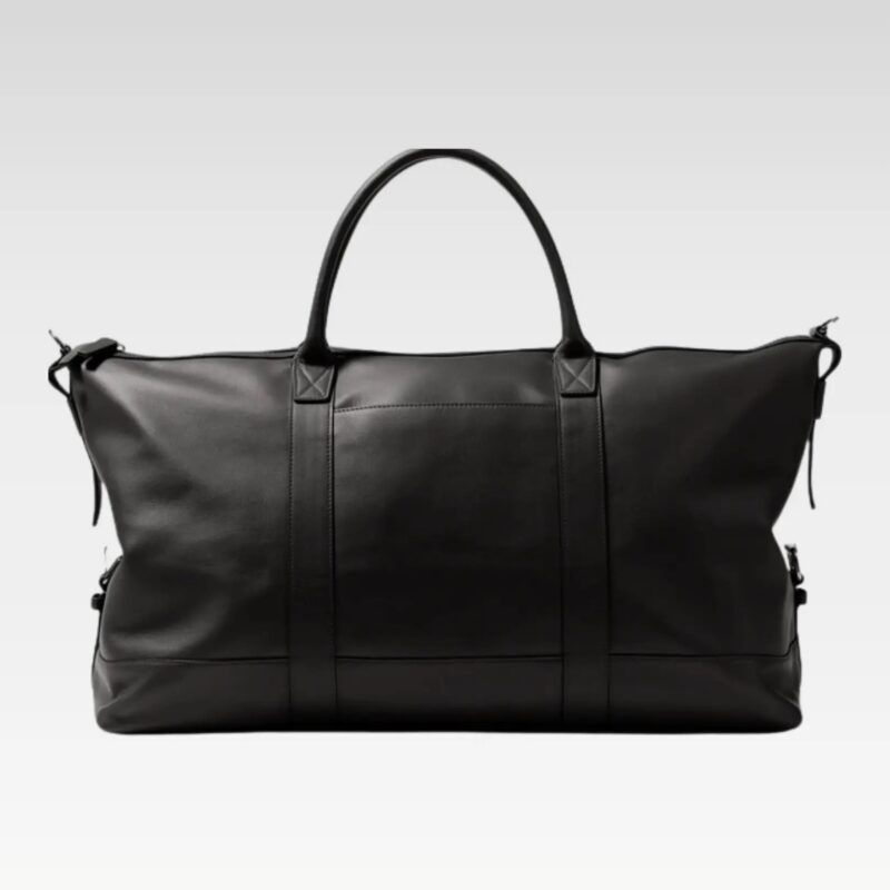 Top view of the Iron Rose Medium Duffle highlighting the smooth full-grain leather exterior, reinforced handles, adjustable side tabs, and secure zipper closure ideal for airline carry-on use.