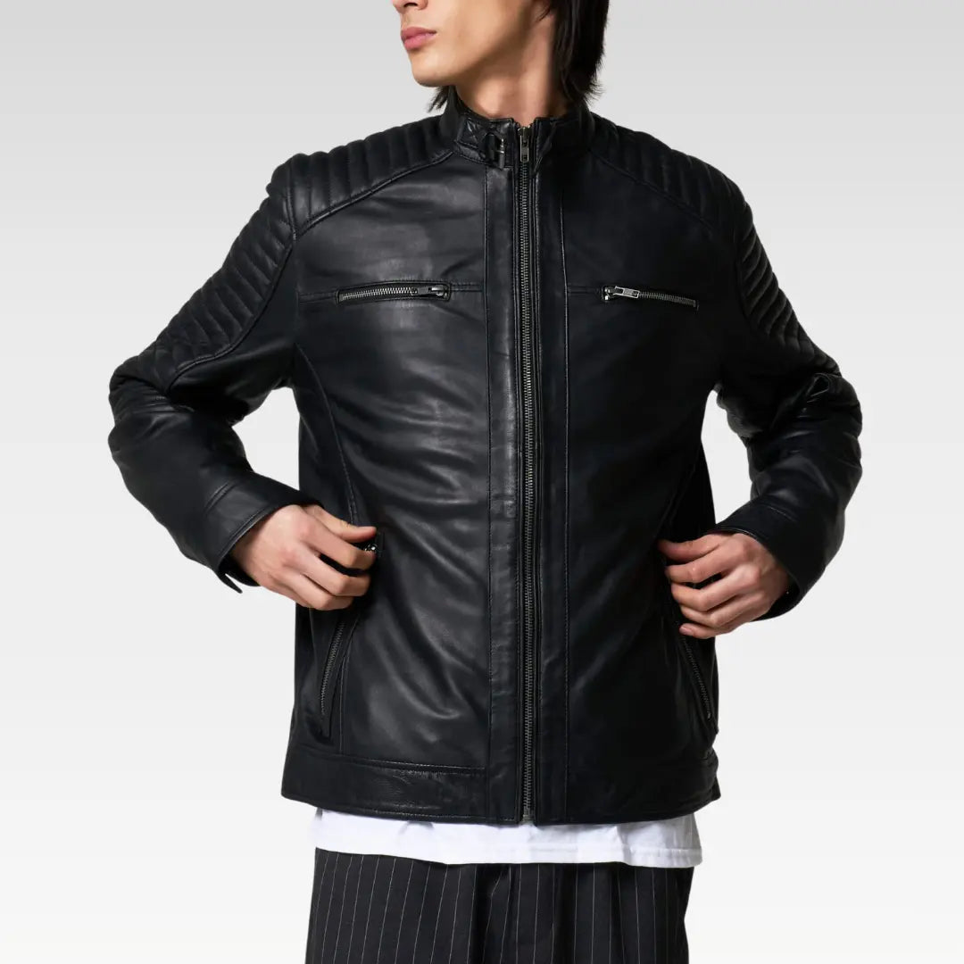 Black leather racer jacket with quilted shoulders, front view showcasing sleek zip details and streamlined fit.