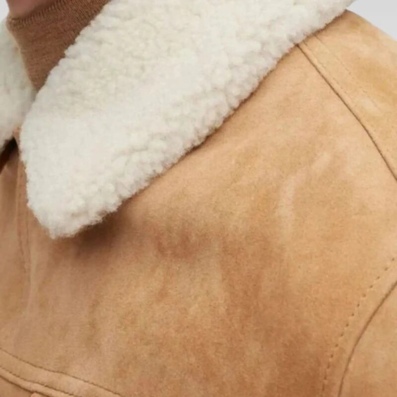 Close-up of a mens classic shirt-style suede jacket in tan, highlighting the soft fur collar and rich goat suede texture, perfect for a luxurious and warm addition to any wardrobe