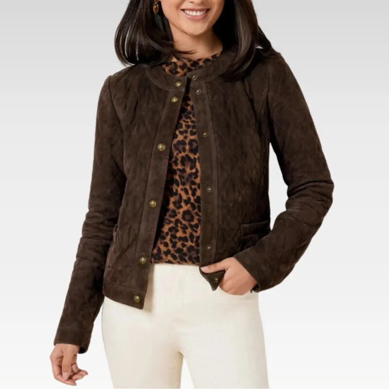Front view of the Nira Quilted Sheepskin Suede Leather Jacket in rich brown genuine suede, featuring elegant quilting, central button closure, and tailored fit, paired with white pants.