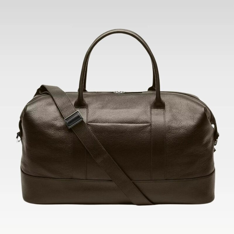 Full view of the Obsidian Premium Leather Duffle in brown leather with top handles and adjustable shoulder strap, ideal for weekend travel.