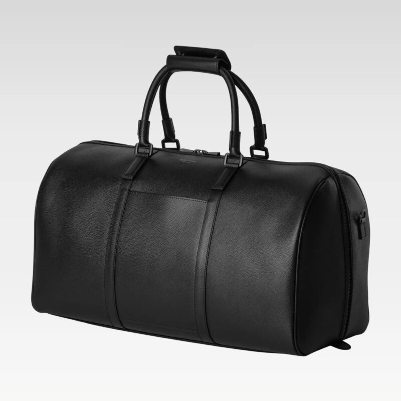 Black Monte leather duffel bag standing upright with double handles, highlighting its premium leather material and minimalist design.