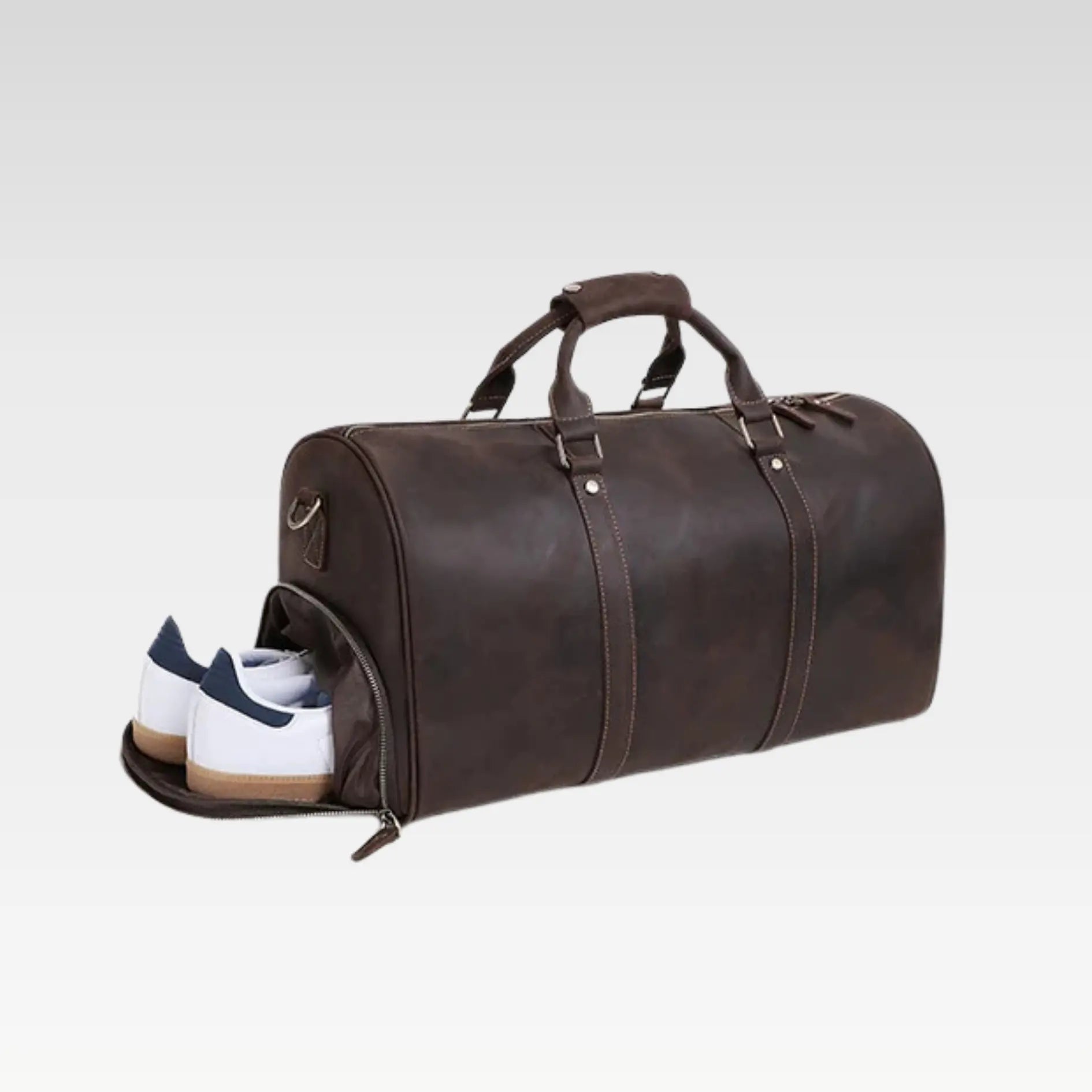 Matt black leather duffle bag rolled compactly to show easy storage and flexible full-grain leather.