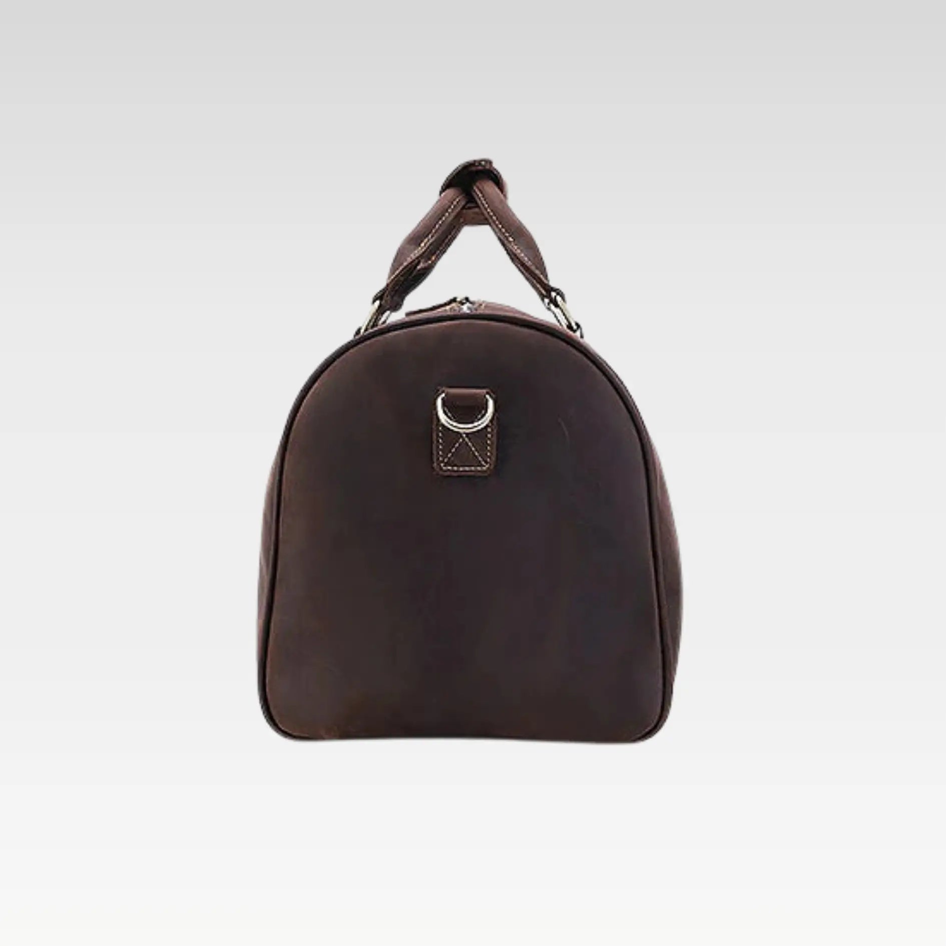 Side profile of the matt brown full-grain leather duffle bag highlighting the detachable shoulder strap.