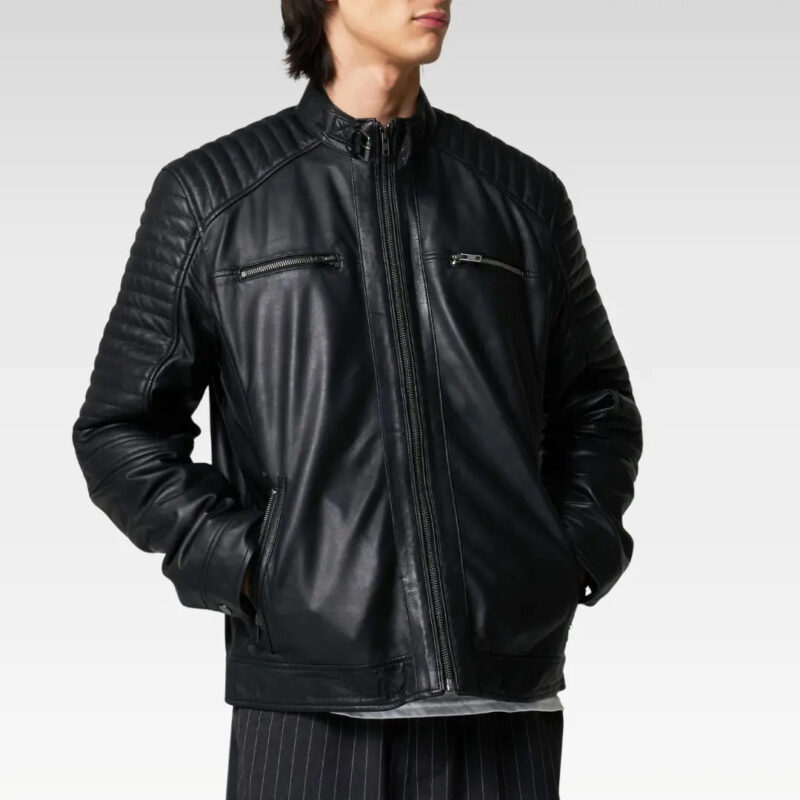 Model wearing black leather racer jacket paired with jeans, showcasing modern and timeless street style