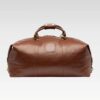 Front view of the Rogue premium full-grain leather travel duffel bag showcasing its rich brown leather and structured shape.