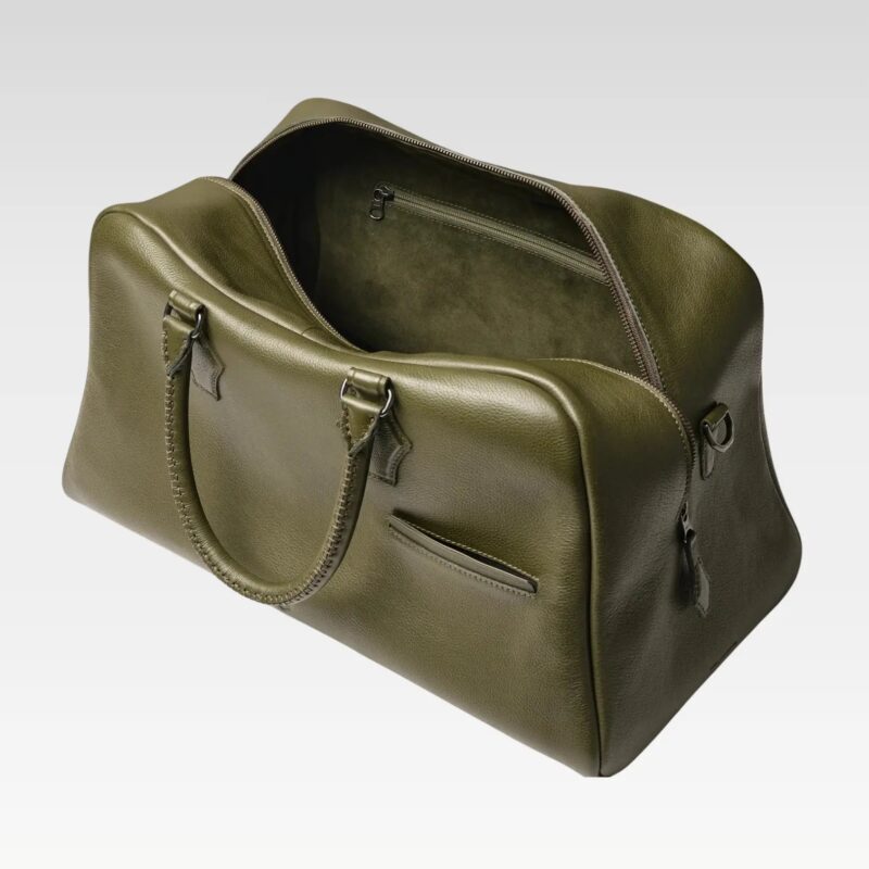 nterior view of the green Sable duffle bag, revealing wide main compartment, color-coded pockets, and easy organization for travel essentials.