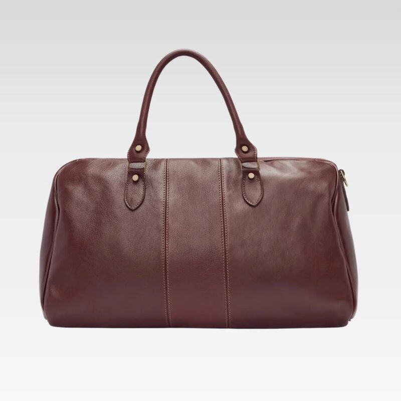 Full product view of the Saddler duffle bag, featuring its sleek silhouette, sturdy handles, and luxe full-grain leather finish.