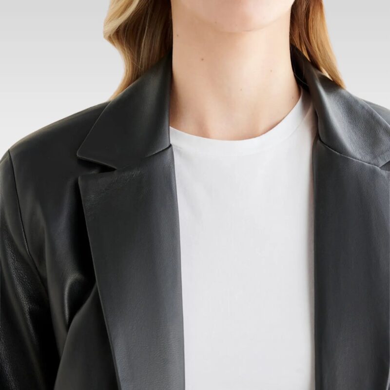 Close-up of Stand Studio Mina blazer in genuine leather, featuring single-button closure and light shoulder padding for modern structure.