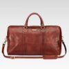 A Front profile of the Stratos Wanderer leather duffel featuring dual handles and an adjustable shoulder strap