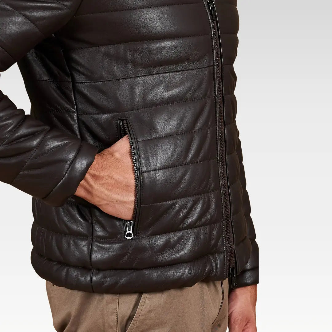 Close-up view of the Teo brown hooded lamb leather puffer jacket showing smooth leather texture and functional zip pocket.