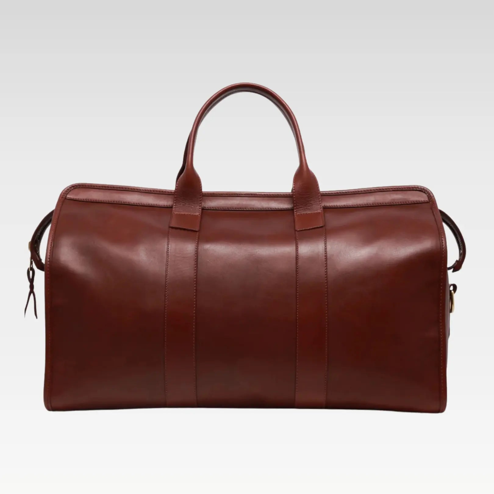 Full exterior view of the Valor Signature Travel Duffle showing polished solid brass hardware, structured design, and premium leather finish.