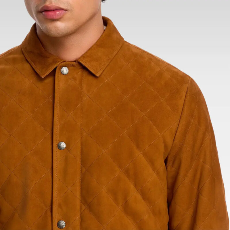 Close-up of the quilted suede sleeve on the Velocity Suffolk jacket showing premium stitching and soft leather texture.