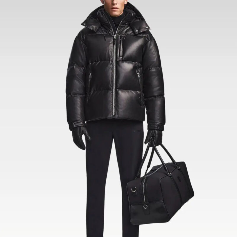 Model wearing the Vincent Men’s Leather Puffer Jacket paired with black trousers and a tote bag, emphasizing its urban versatility.