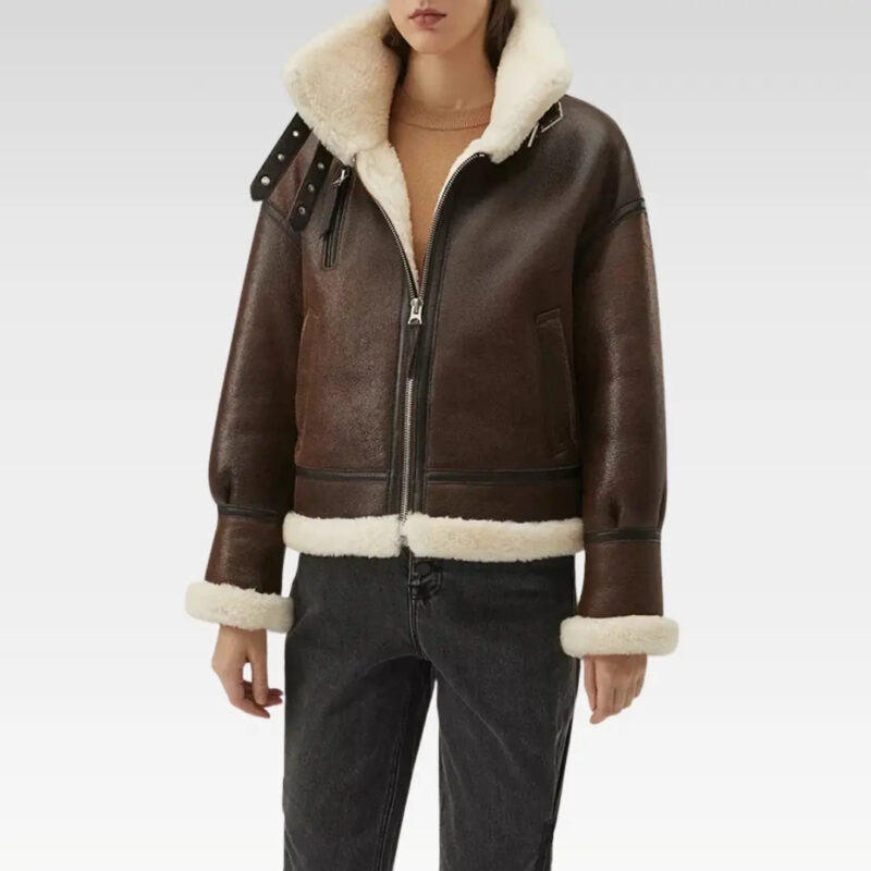 Close-up of the collar on a women's dark brown leather faux shearling coat jacket, highlighting the plush faux fur lining and premium sheepskin leather for luxurious warmth