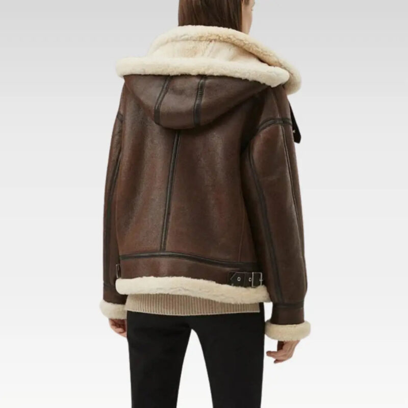 Back view of a chic women's faux shearling leather jacket in dark brown, highlighting the removable hood and tailored design, ideal for versatile winter outfits.