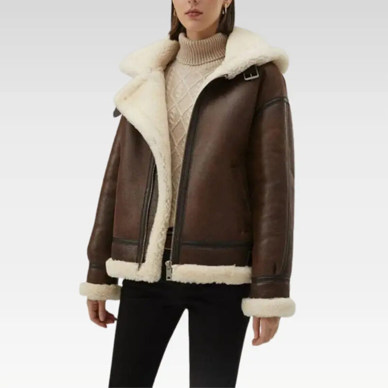 Front view of a stylish women's faux shearling leather jacket in dark brown, showcasing a detachable hood, front zipper, and soft shearling interior for warmth and elegance.