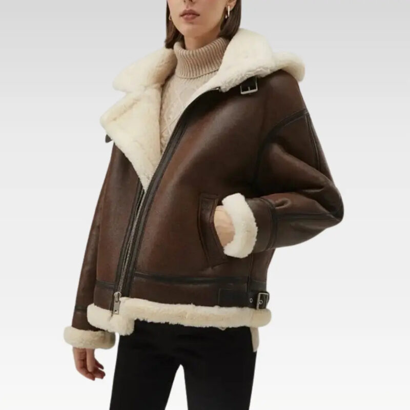 Rear angle view of a luxurious women's faux shearling leather jacket in dark brown, featuring a detachable hood and sleek design, perfect for stylish winter wear.